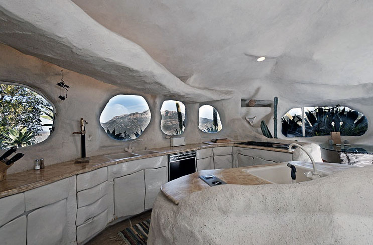 Creative-Flintstone-Style-House-Cave-Rock-Kitchen-Round-Windows-Design